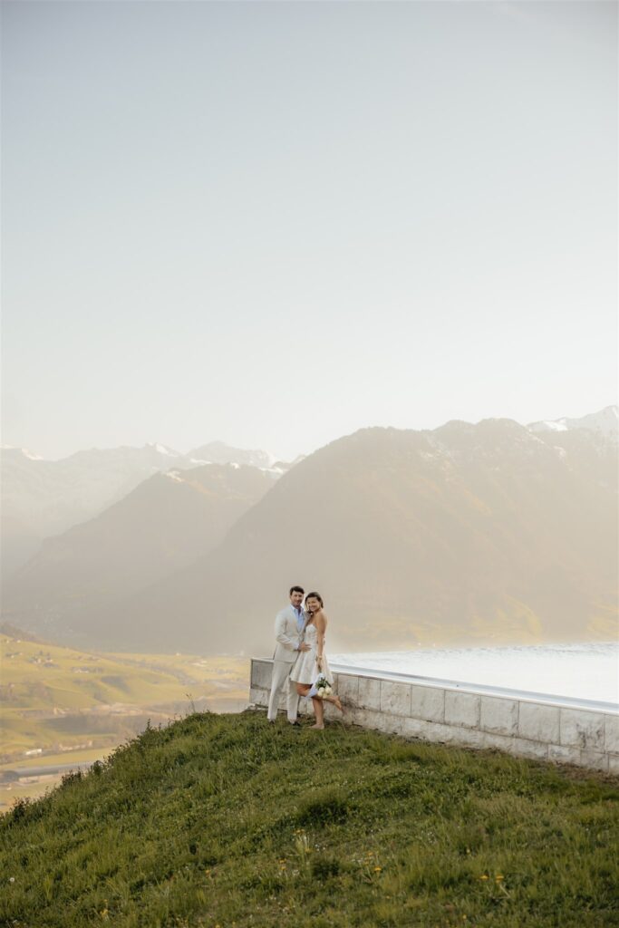 newly engaged couple posing for the camera