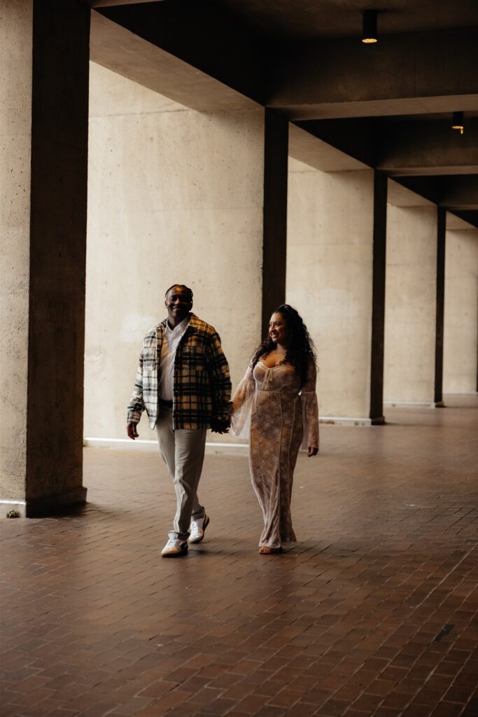 couple walking around their dream engagement location