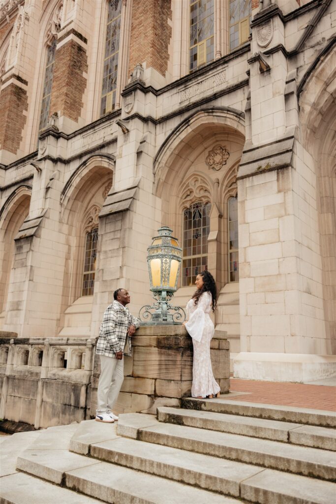 newly engaged couple looking and smiling at each other 