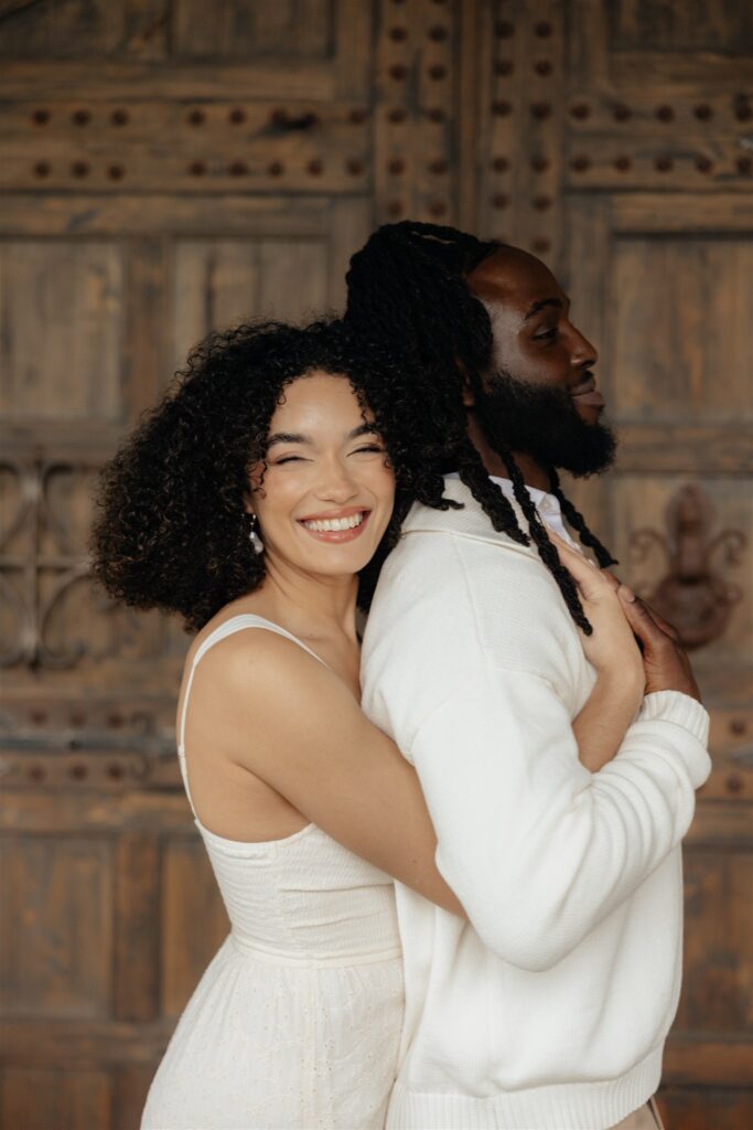 couple smiling at the camera during their session