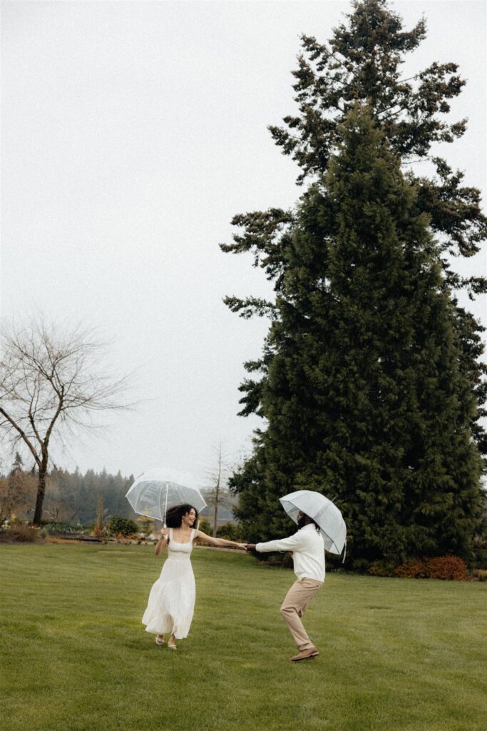 cute newly engaged couple dancign during their photoshoot