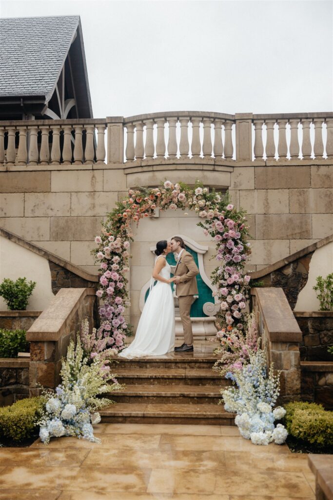 bride and groom kissing after their wedding ceremony 