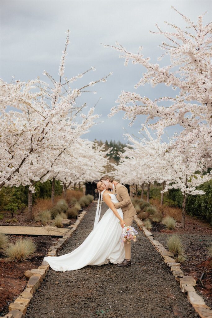 groom kissing the bride on the neck
