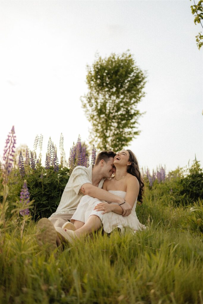 couple laughing with each other during their session