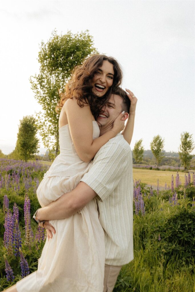 couple smiling at the camera during their Van Lierop Park Engagement Session