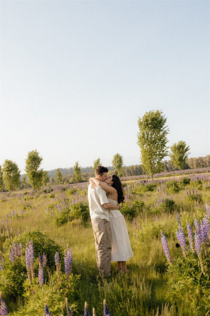 portrait of the newly engaged couple kissing