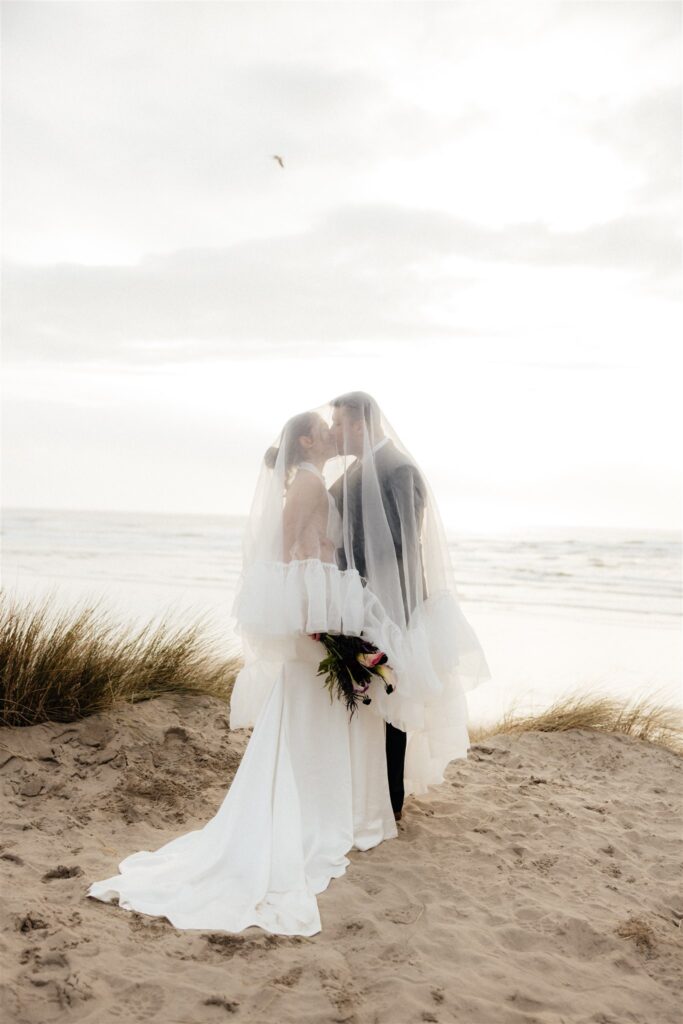 cute picture of the bride and groom kissing 