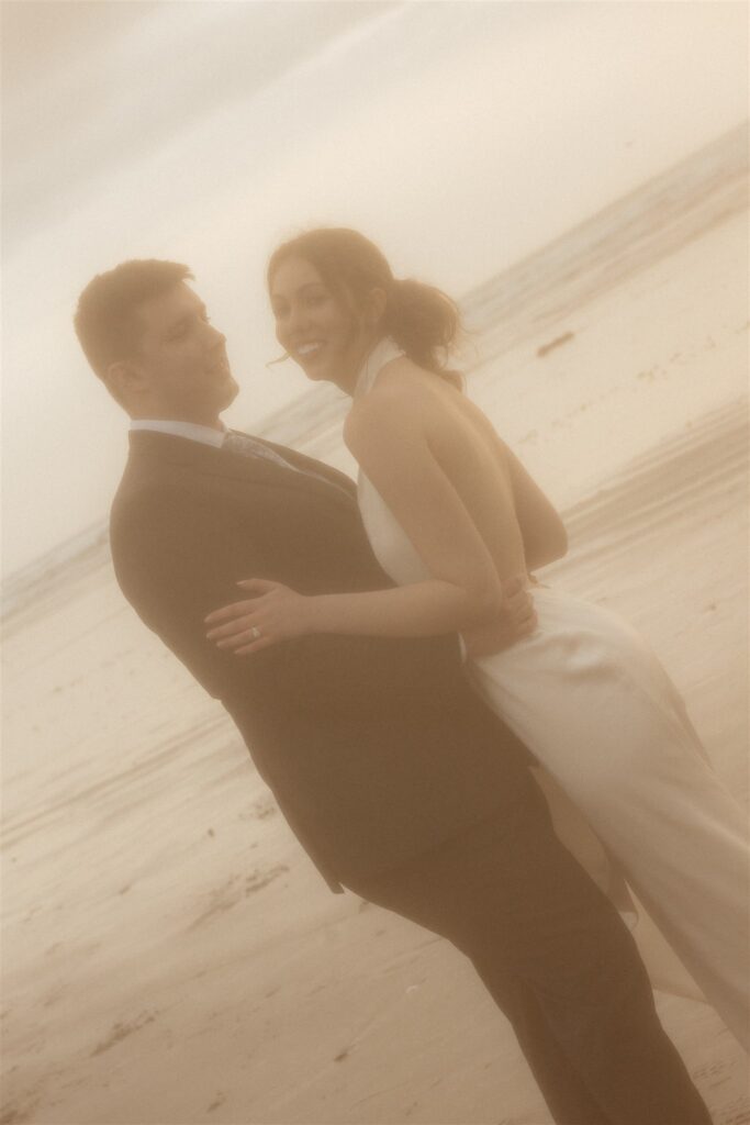 cute couple smiling at each other during their photoshoot