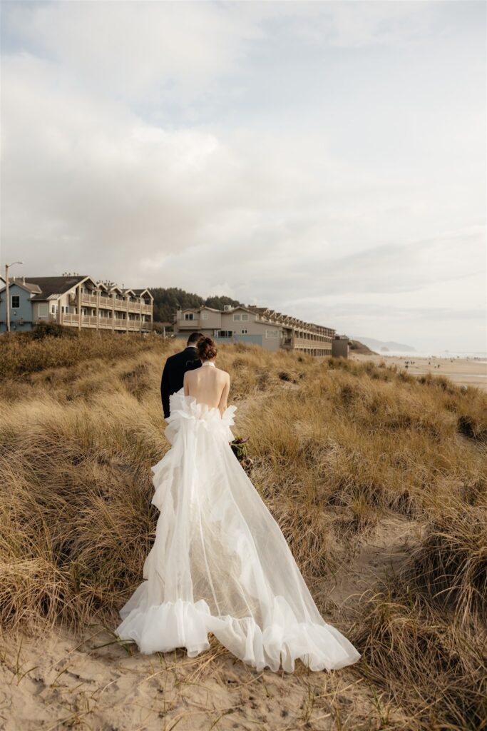 couple walking around cannon beach 
