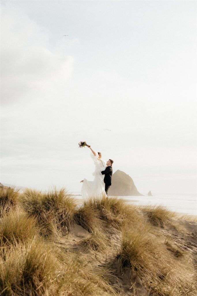 cute picture of the newly eloped couple at cannon beach 