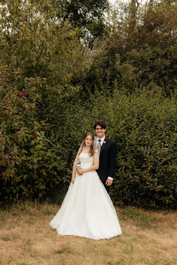 bride and groom posing for the camera during their bridal session