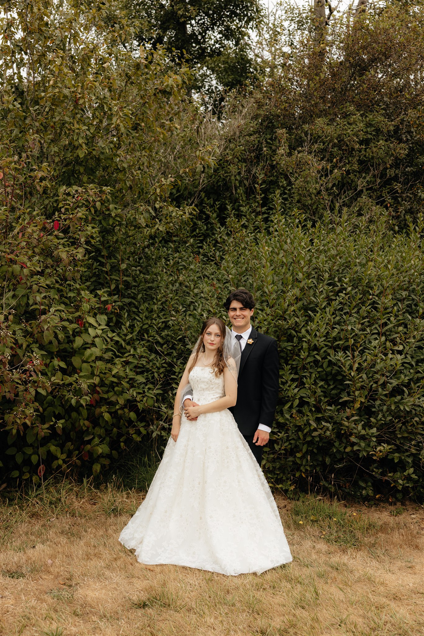 bride and groom posing for the camera during their bridal session