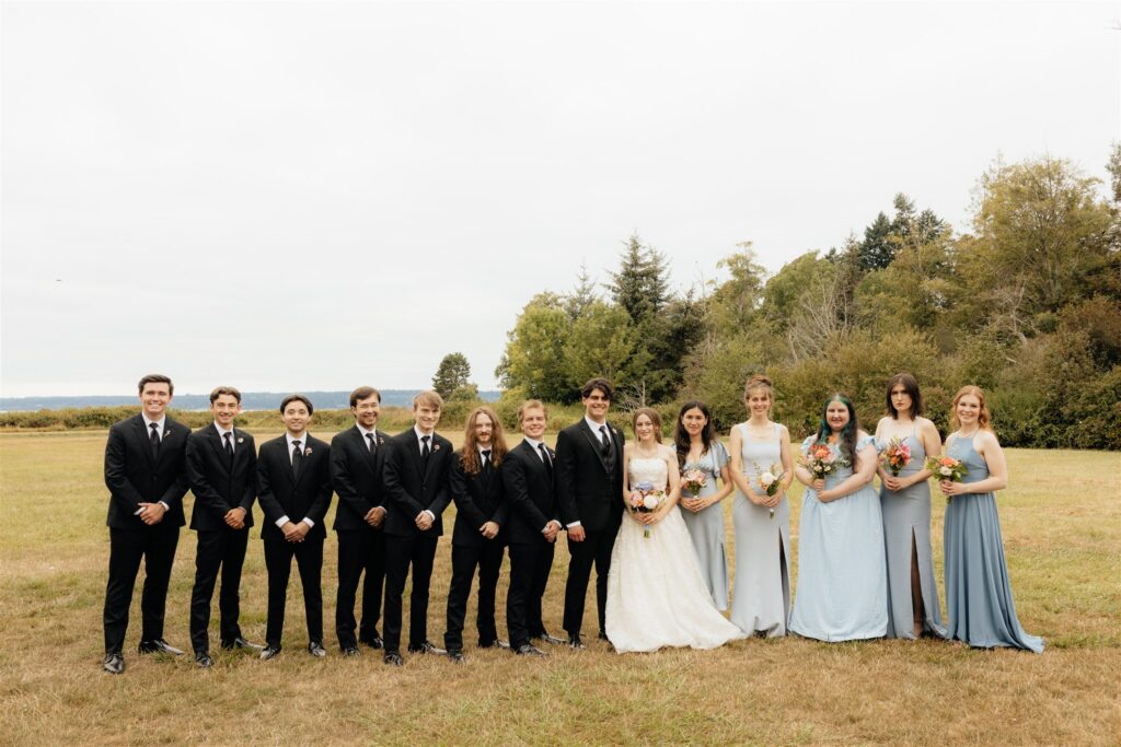 cute picture of the bride and groom with their bridal party
