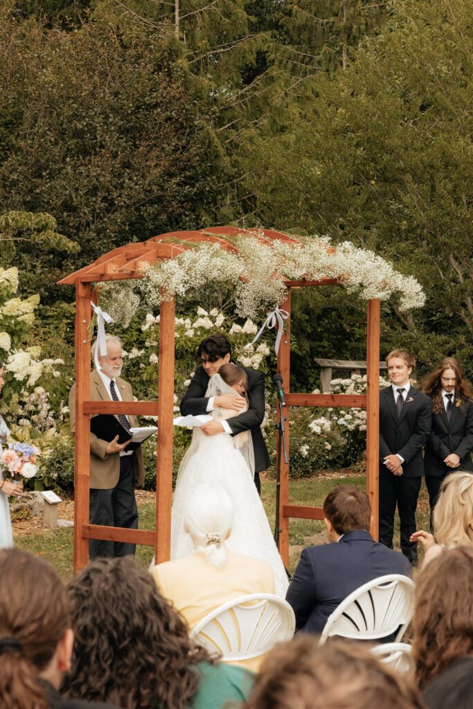 Bride and groom, kissing after their ceremony