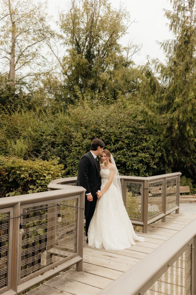groom, kissing the bride on the forehead