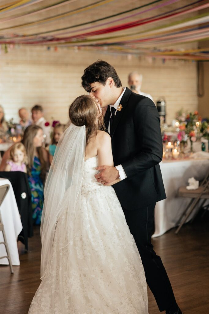 Portrait of the newlyweds, kissing
