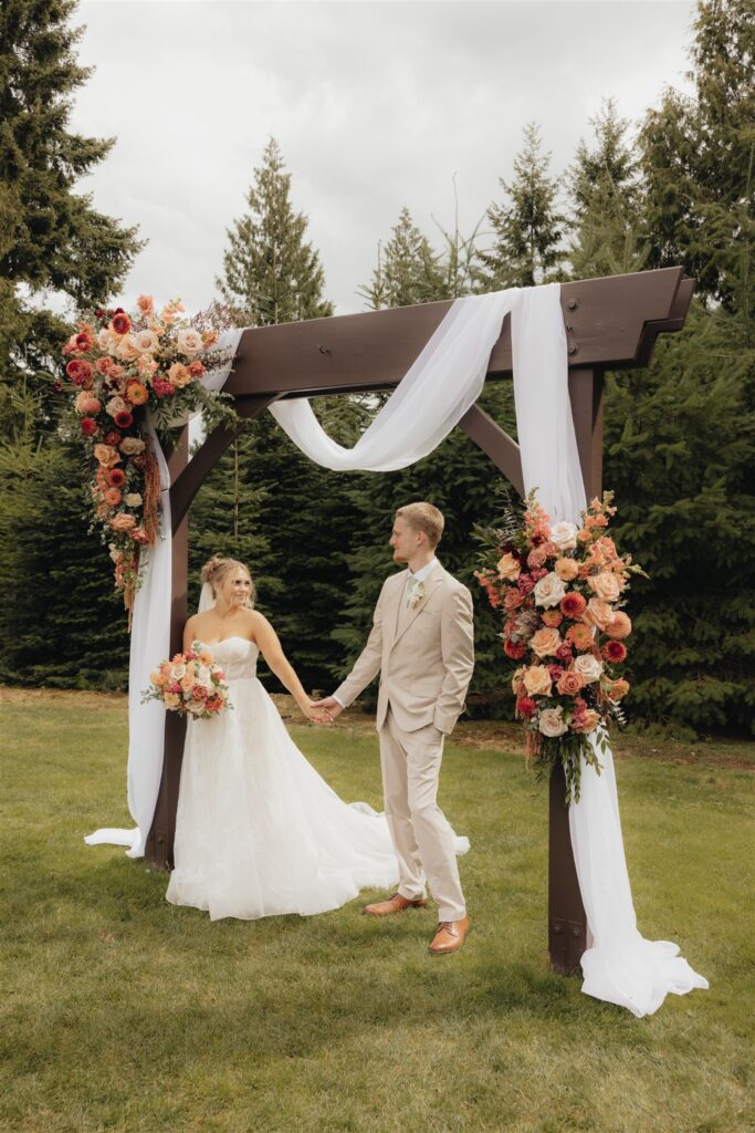 cute picture of the bride and groom holding hands