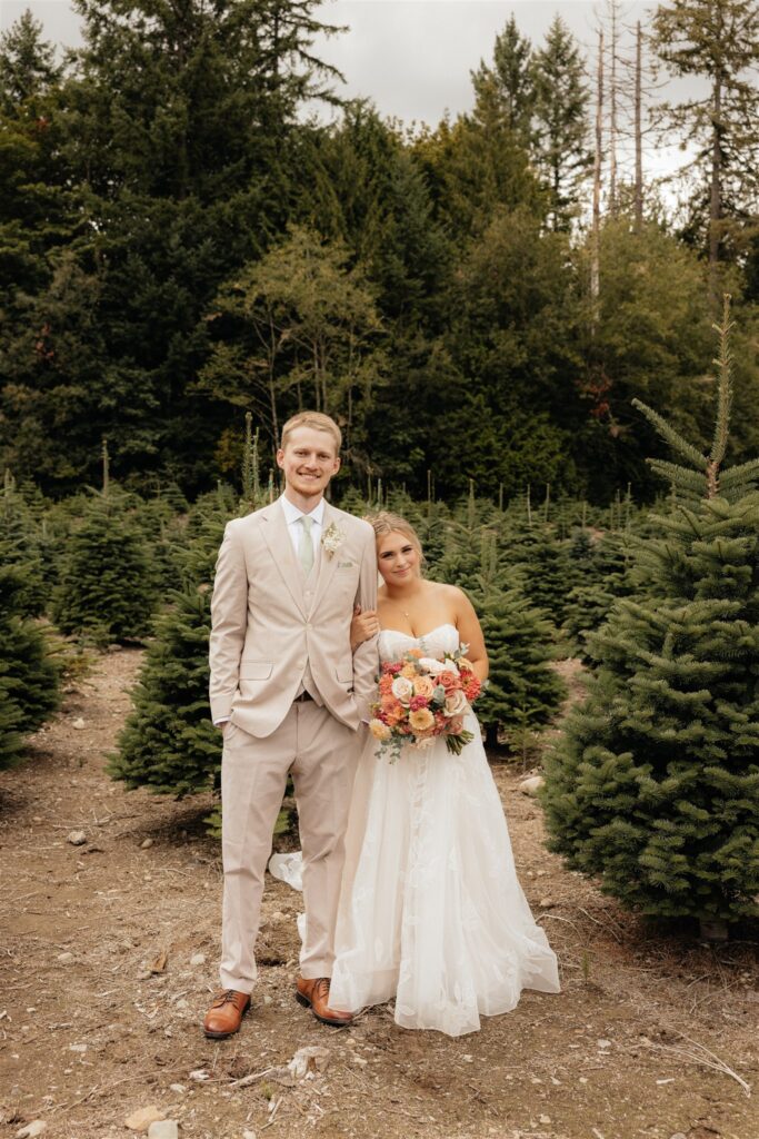 bride and groom posing for the camera during their bridal portraits