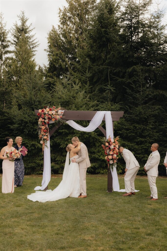 bride and groom kissing after their ceremony