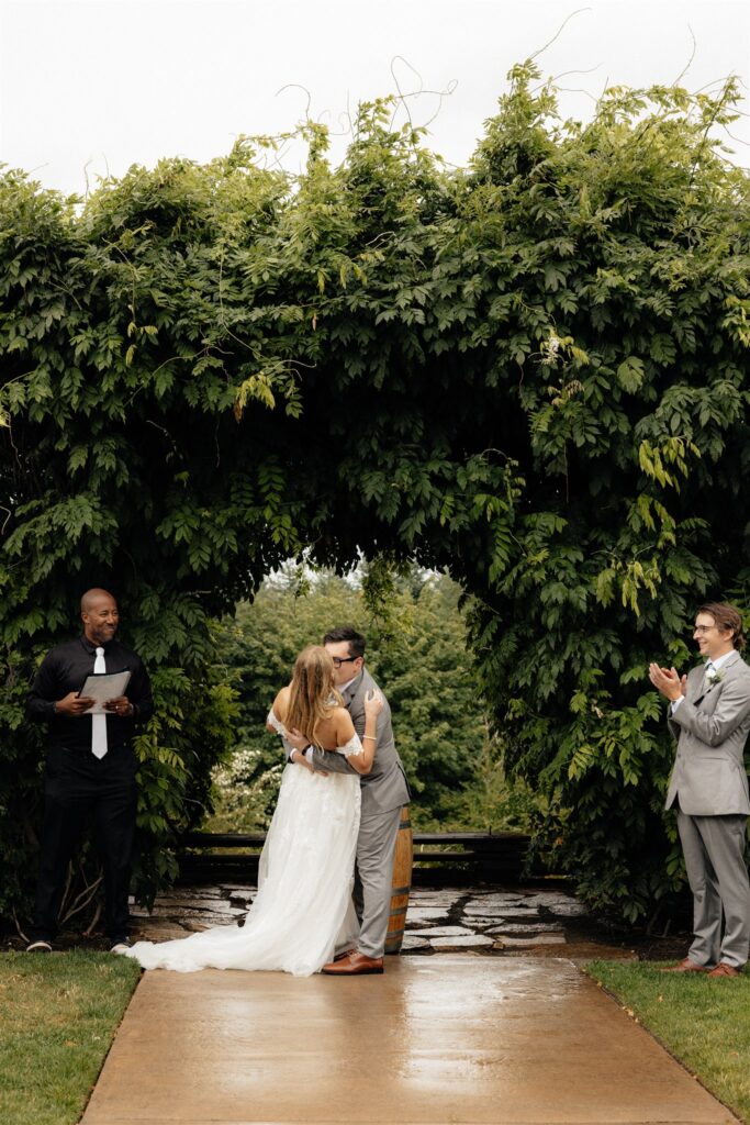 bride and groom kissing after their ceremony