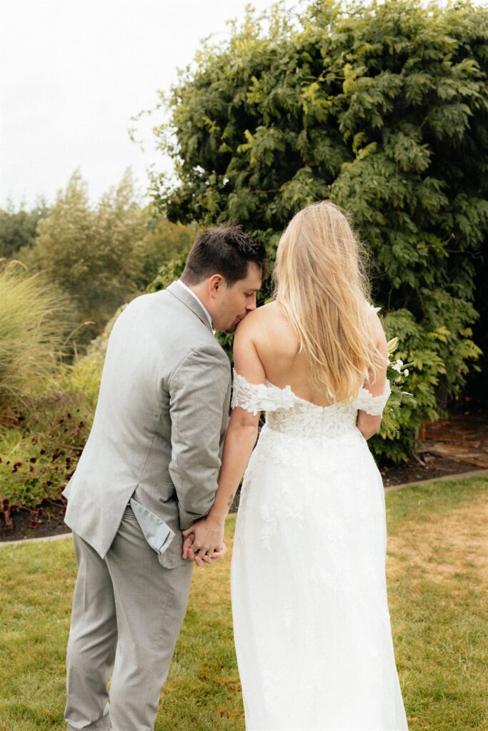 groom kissing the bride on the cheek