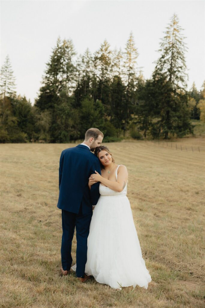 groom kissing the bride on the forehead 