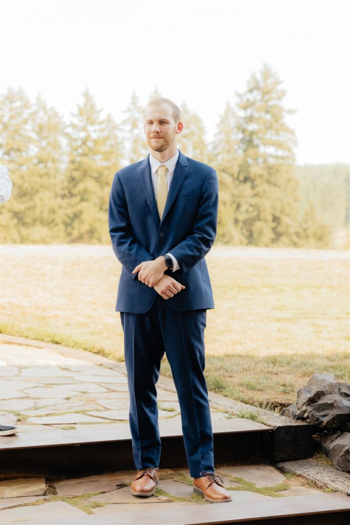 groom emotional watching the bride walk down the aisle