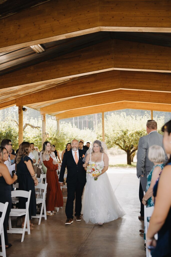 cute picture of the bride walking down the aisle