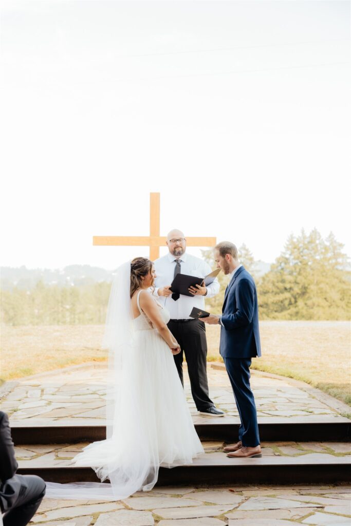 Couple reading their vows during their wedding ceremony