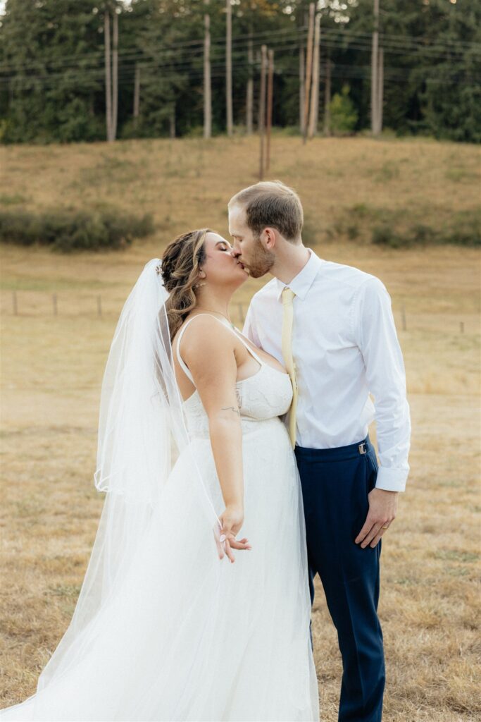 cute picture of the bride and groom kissing