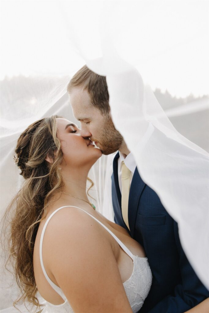 stunning portrait of the newlyweds kissing