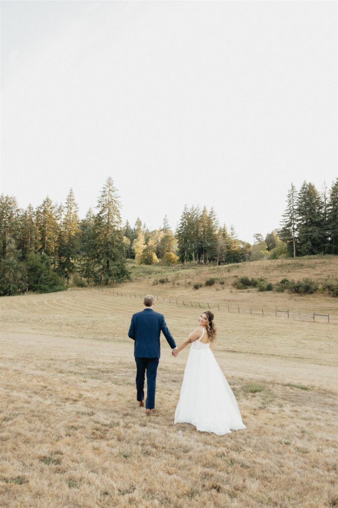 cute picture of the bride and groom holding hands