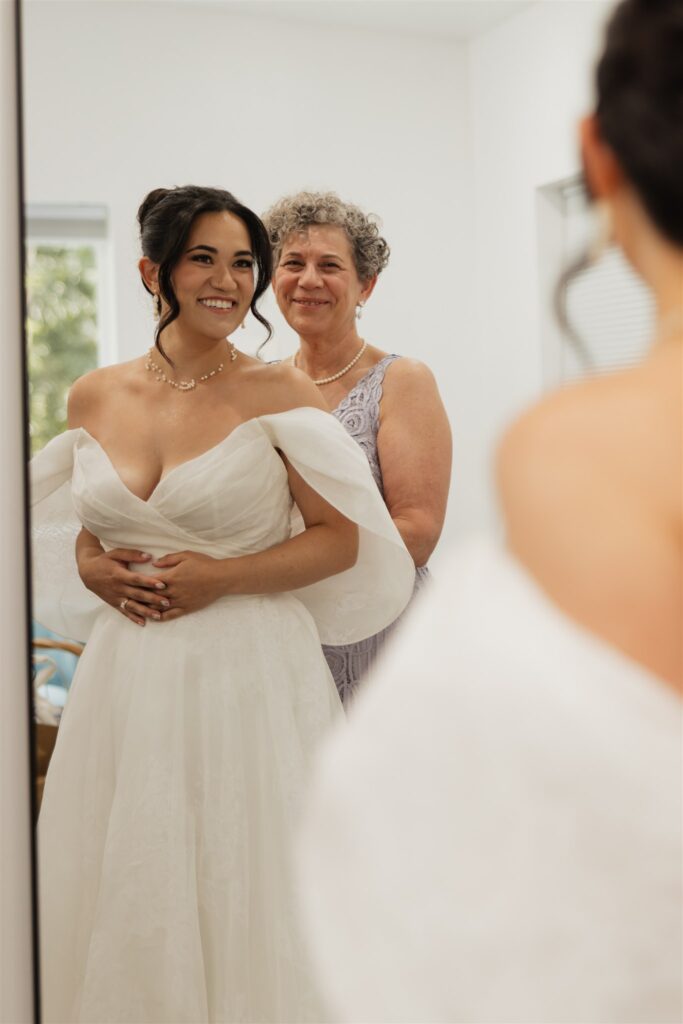cute picture of the bride and her mom hugging 