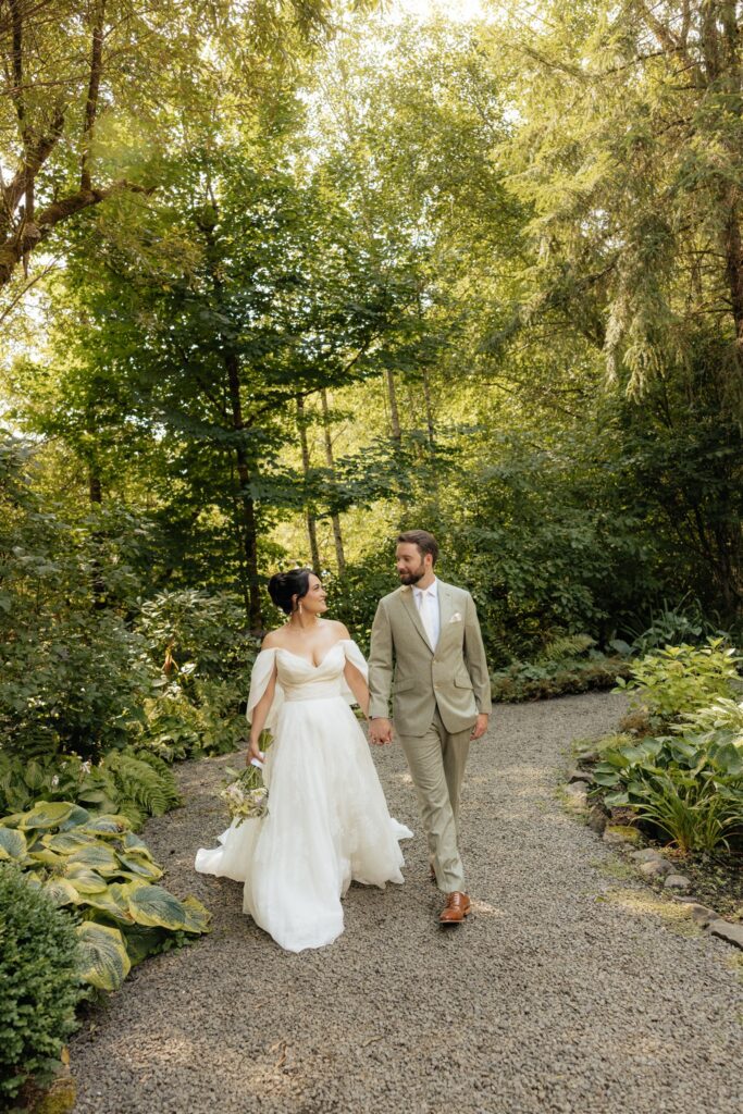 cute picture of the bride and groom holding hands