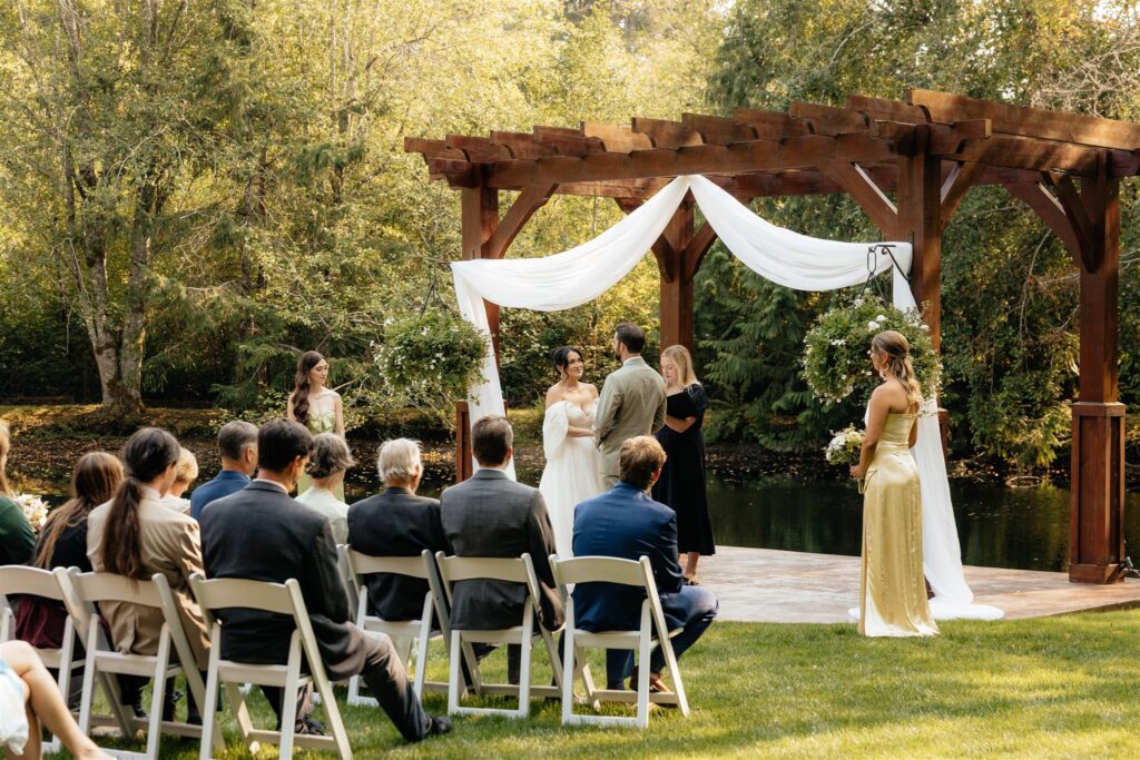 bride and groom holding hands during their wedding ceremony