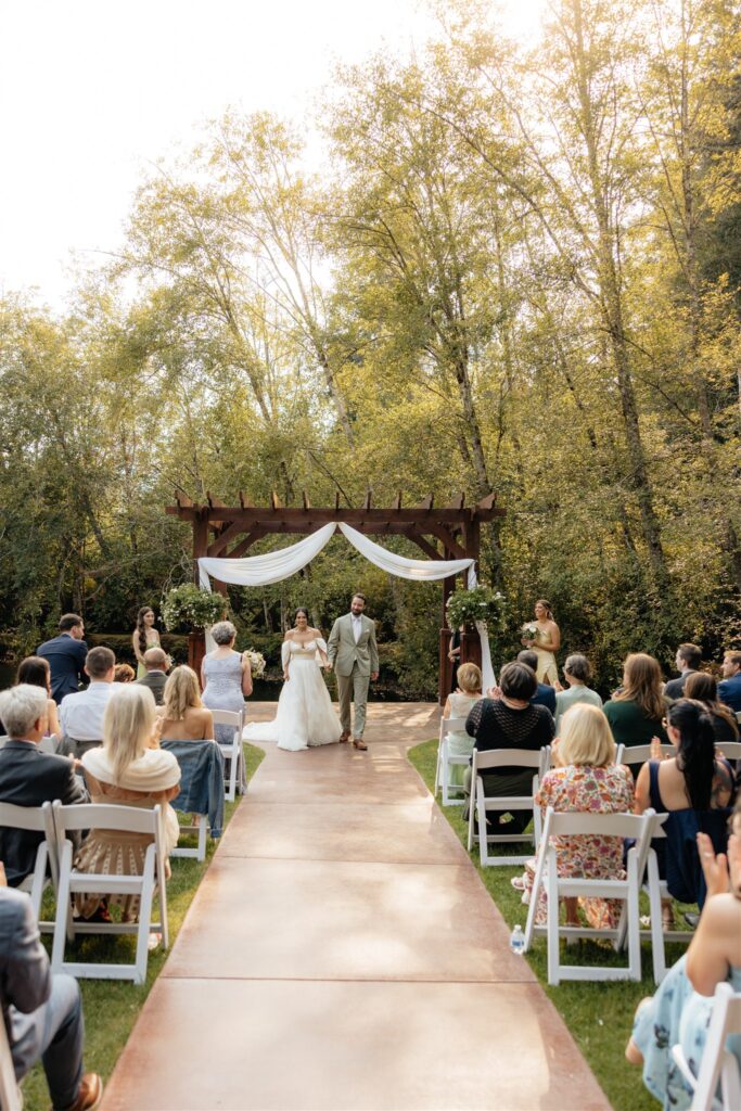 bride and groom heading to their wedding recption