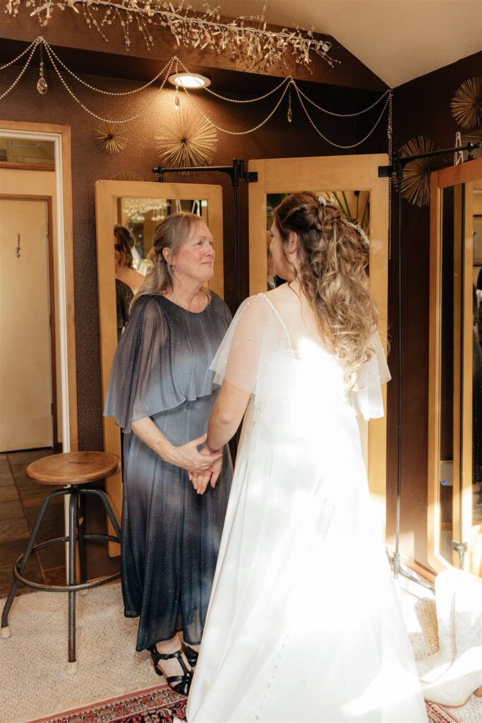 cute picture of the bride and her mom hugging