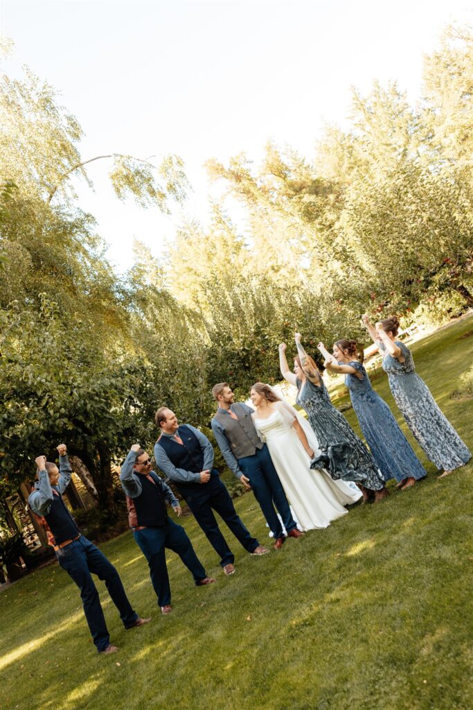 cute picture of the bride and groom with their bridal parties