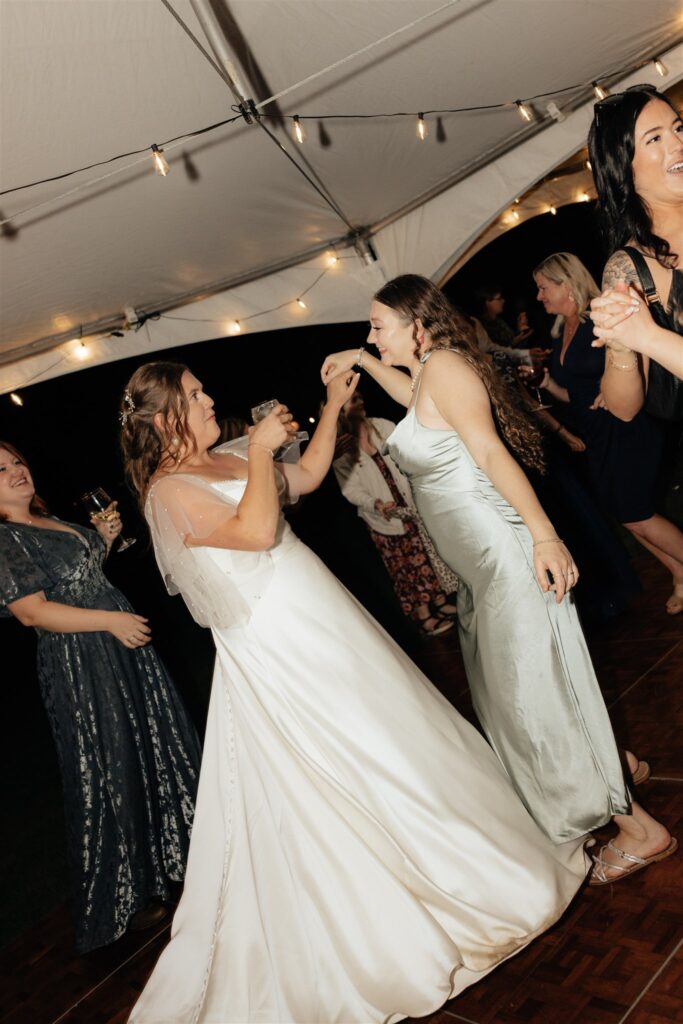 bride having the best time at her wedding reception party