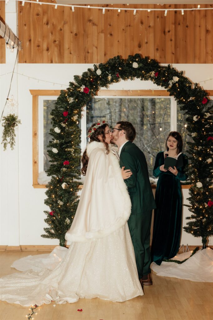 Bride and groom kissing after their wedding ceremony