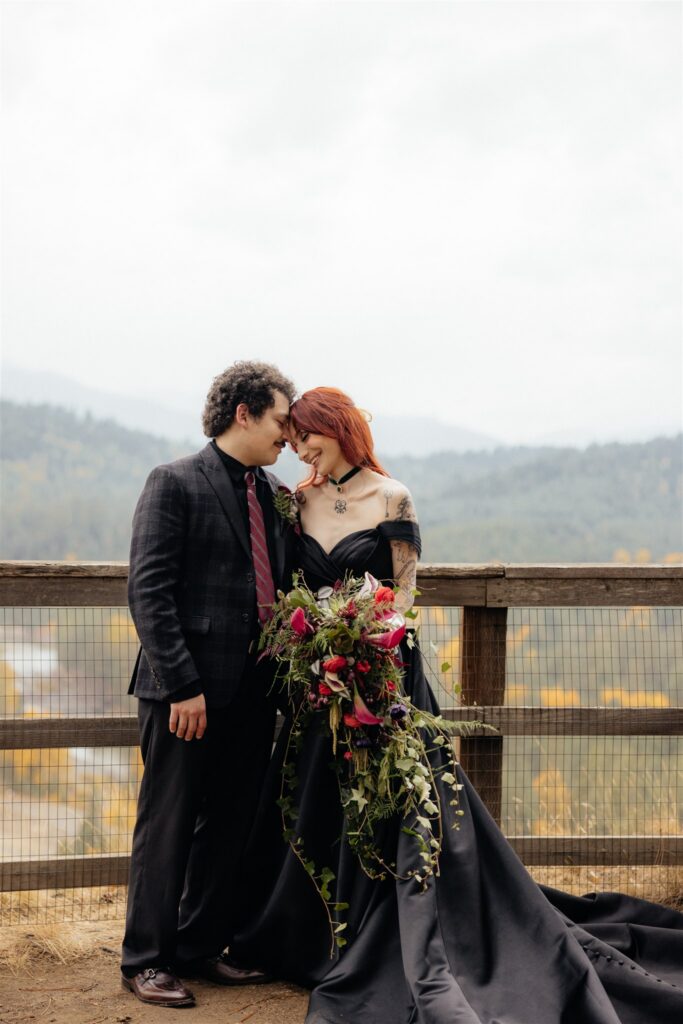 Groom, kissing the bride on the forehead