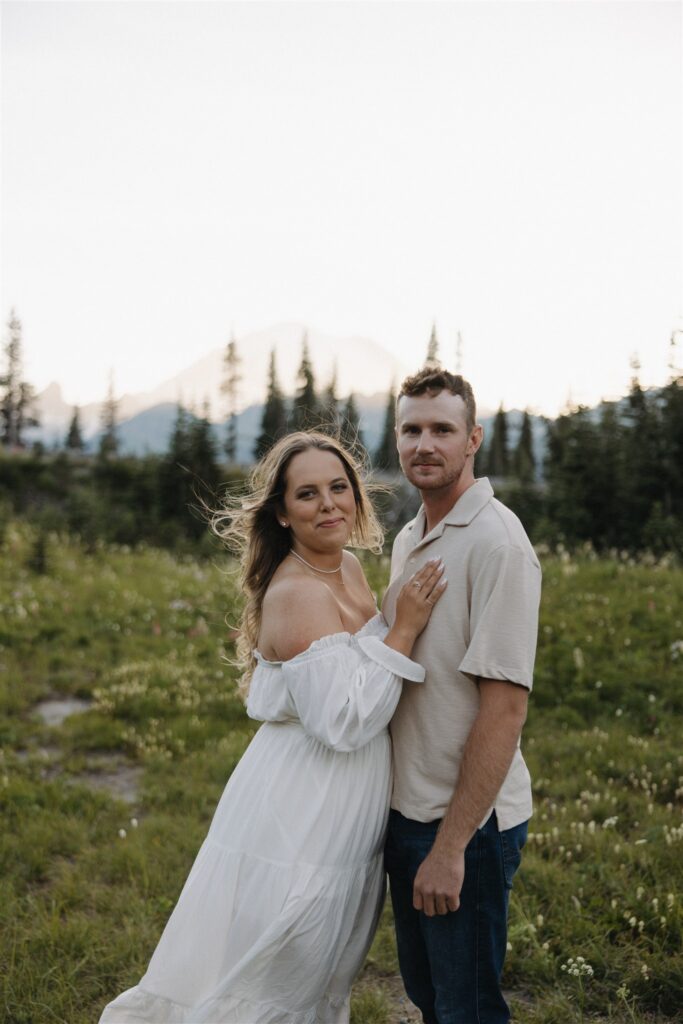 couple smiling at the camera during their photoshoot