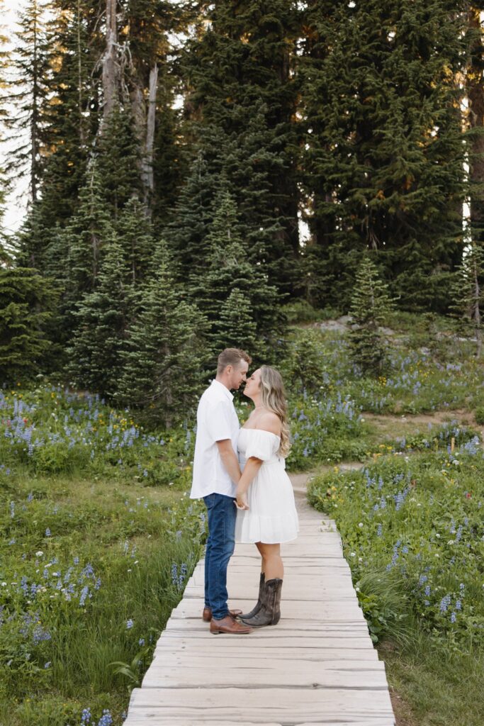 cute picture of the newly engaged couple kissing