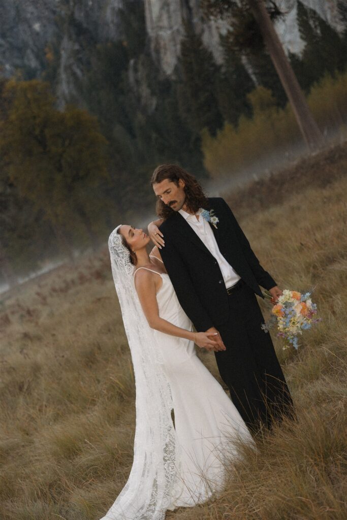 Picture of the newly married couple smiling at each other