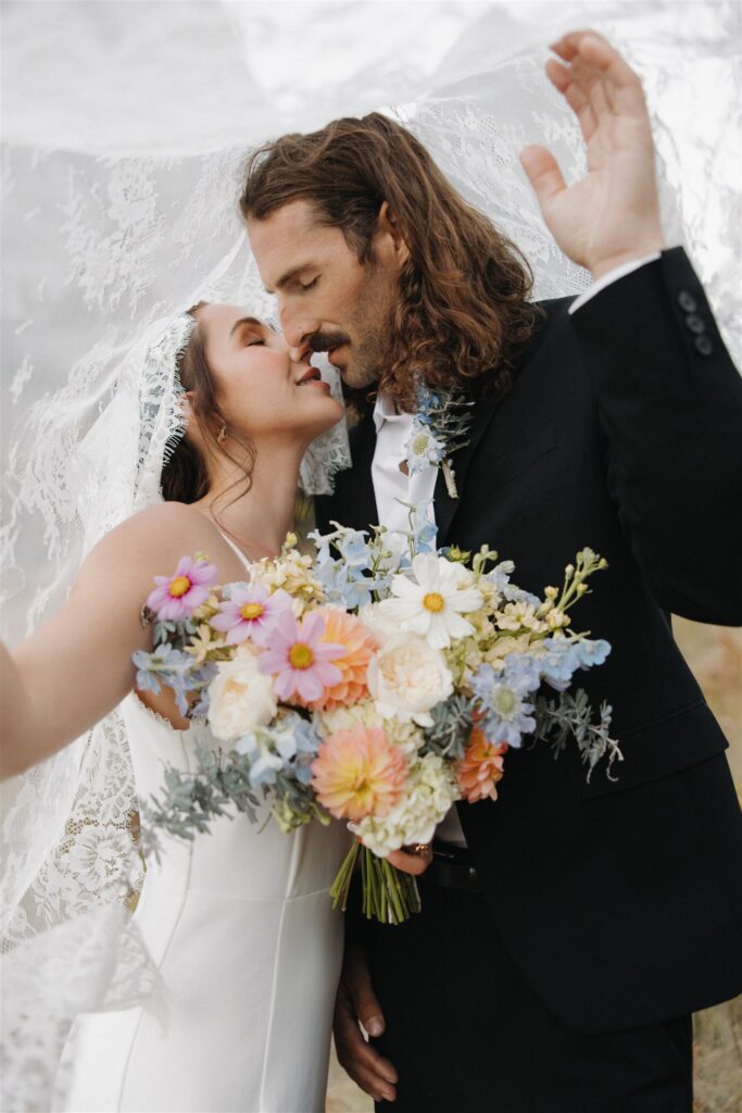 Portrait of the newly married couple kissing