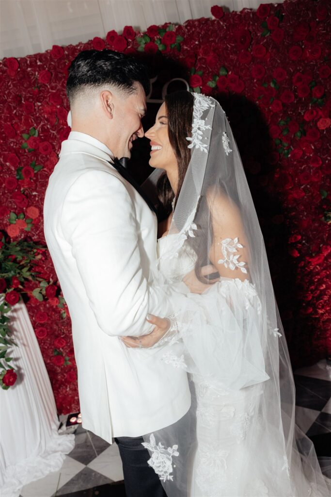 picture of the bride and groom smiling at each other
