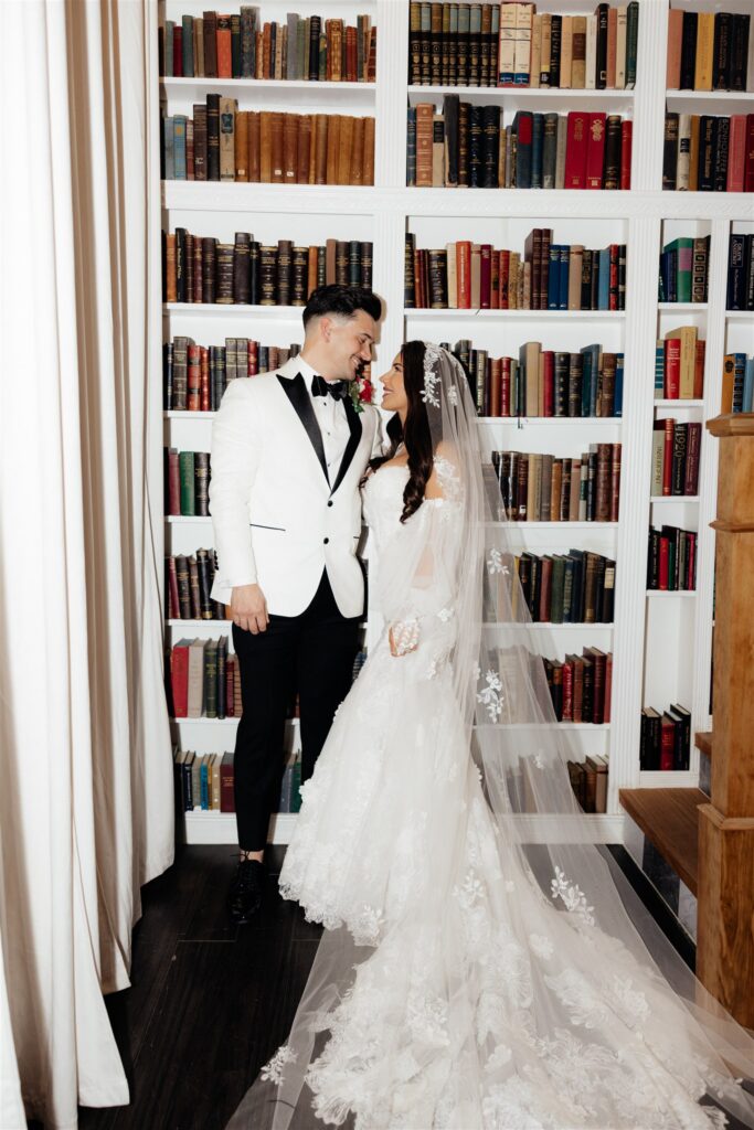 portrait of the newlyweds laughing with each other during their bridal photos