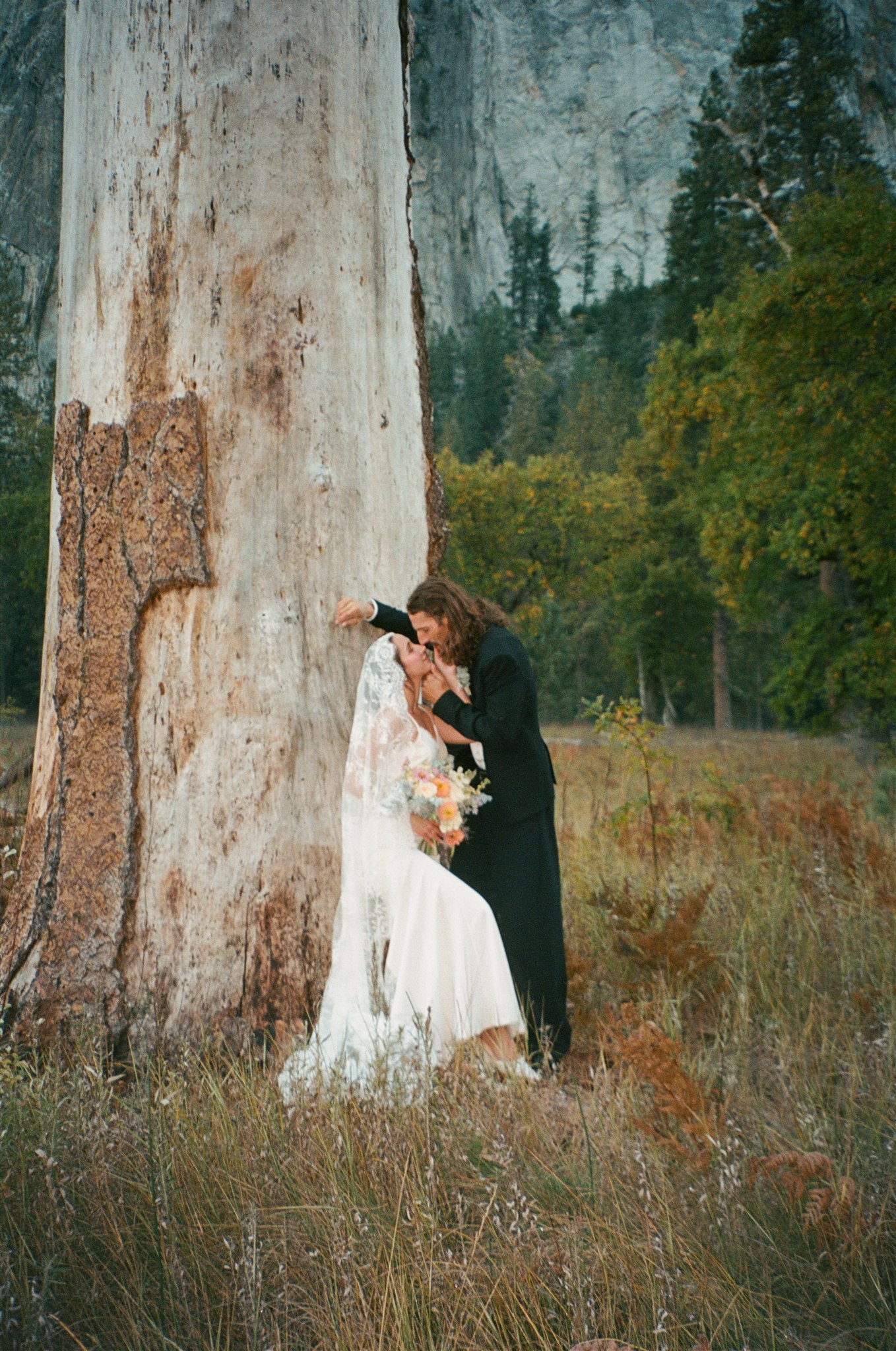cute picture of the bride and groom kissing