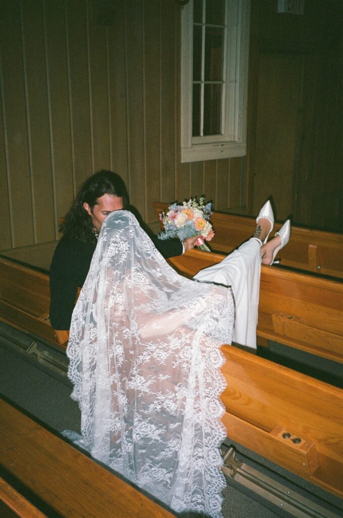 cute picture of the groom kissing the bride on the cheek