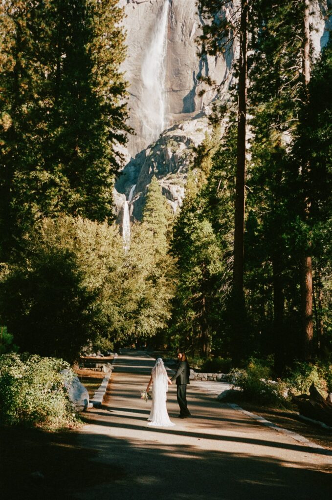 bride and groom holding hands during their photoshoot